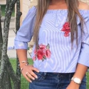 Off the shoulder blue and floral shirt